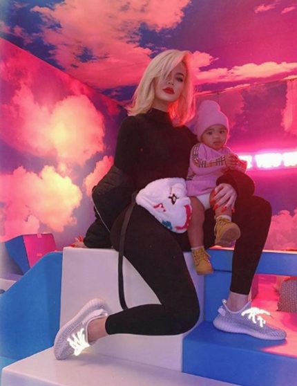 Khloe Kardashian posing with daughter True