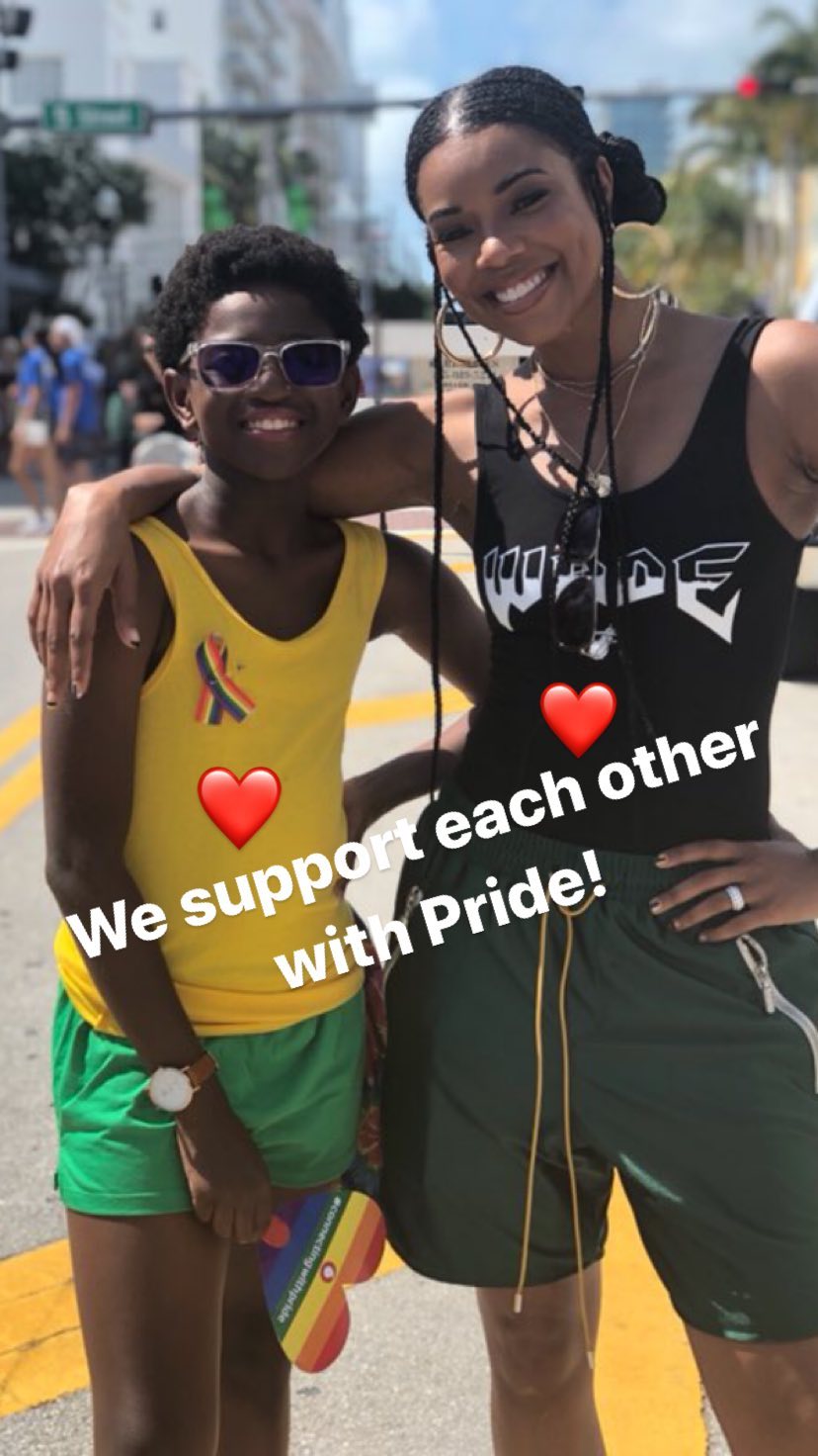 gabrielle and zion pose at pride
