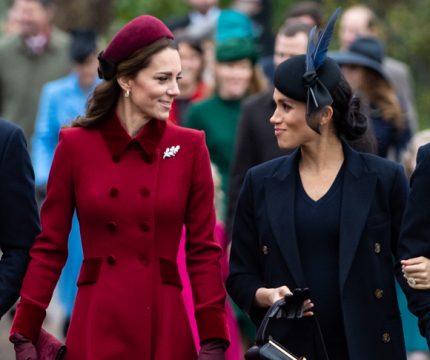 Meghan Markle and Kate Middleton smile through their feud