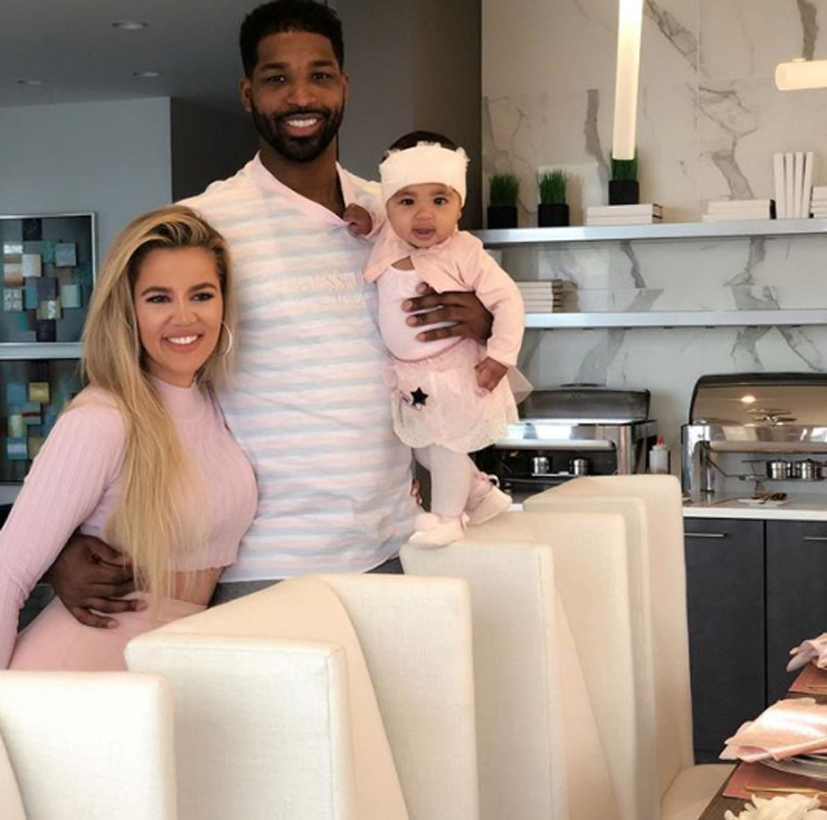Khloe Kardashian poses with Tristan Thompson and baby True