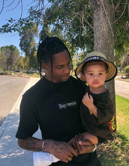 Travis Scott holds baby Stormi