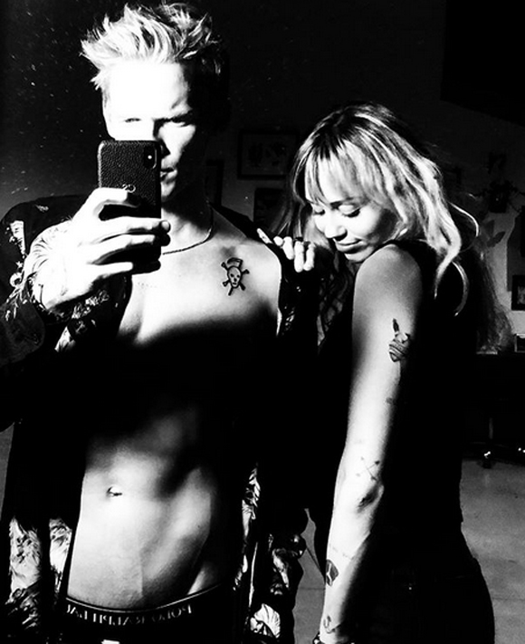 Cody Simpson and Miley Cyrus show off their matching tattoos