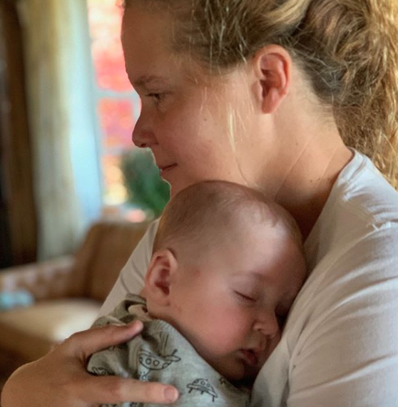 amy schumer cuddles son gene