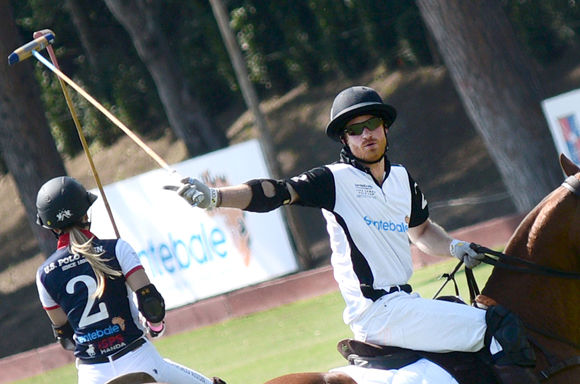 Prince Harry playing polo