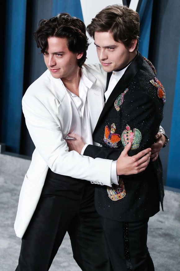 Cole posed with his twin brother Dylan instead of girlfriend Lili during red carpet arrivals for Vanity Fair.