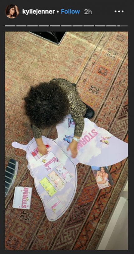 Stormi Webster playing with makeup.