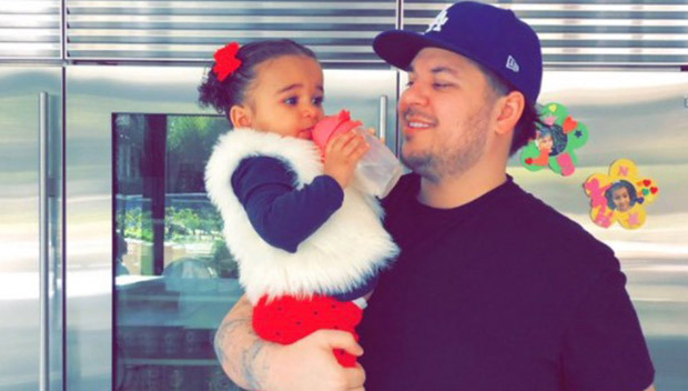 rob kardashian holding his daughter dream kardashian
