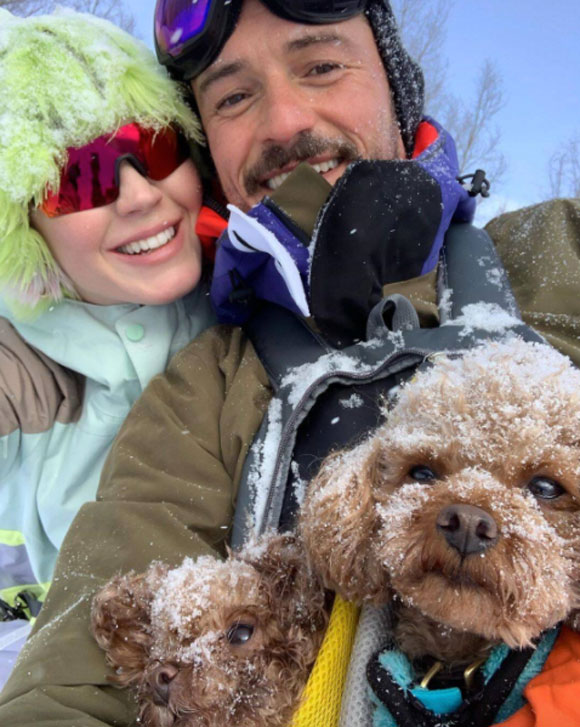 Orlando Bloom and Katy Perry enjoying a winter getaway with their two dogs, Mighty and Nugget.