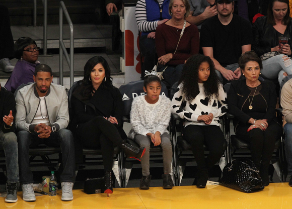 Vanessa Bryant enjoying a Lakers basketball game with two of her daughters and mom Sofia Laine.