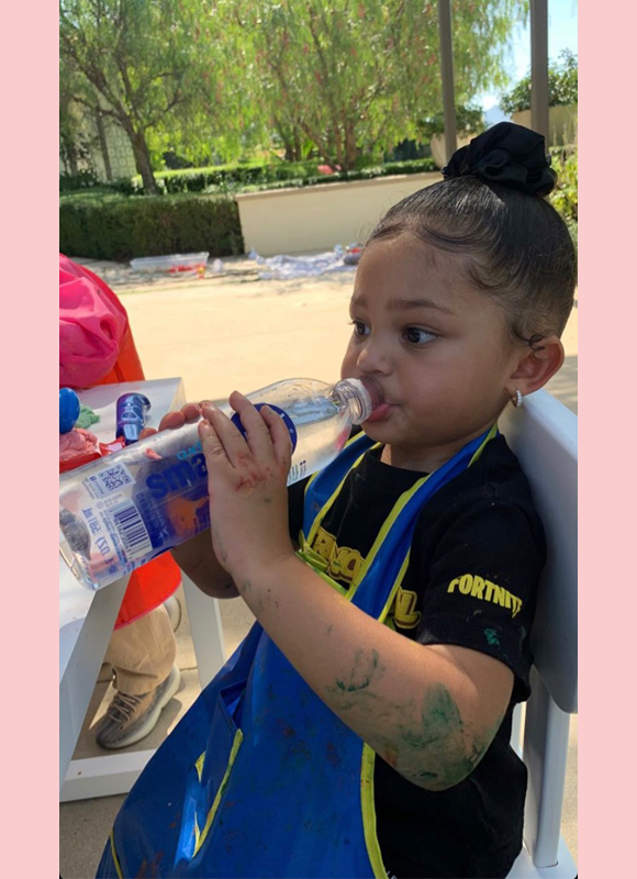 Stormi Webster wears a pink Hermès Kelly backpack to her first day