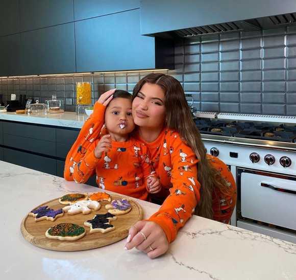 Kylie Jenner posing with her daughter Stormi Webster after making Halloween cookies!
