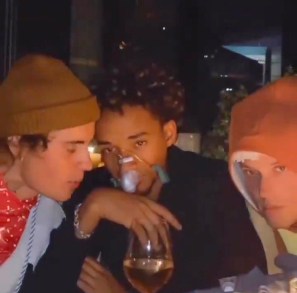 Jaden Smith seen wearing an oxygen mask while speaking with Justin Bieber at a Halloween party.