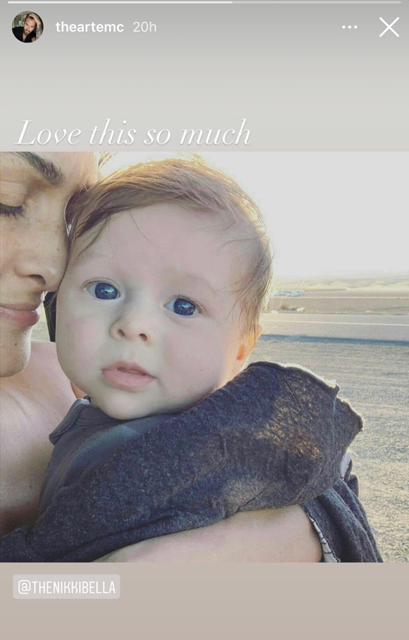 Artem Chigvintsev shares a photo of Nikki Bella holding their son Matteo on her birthday.