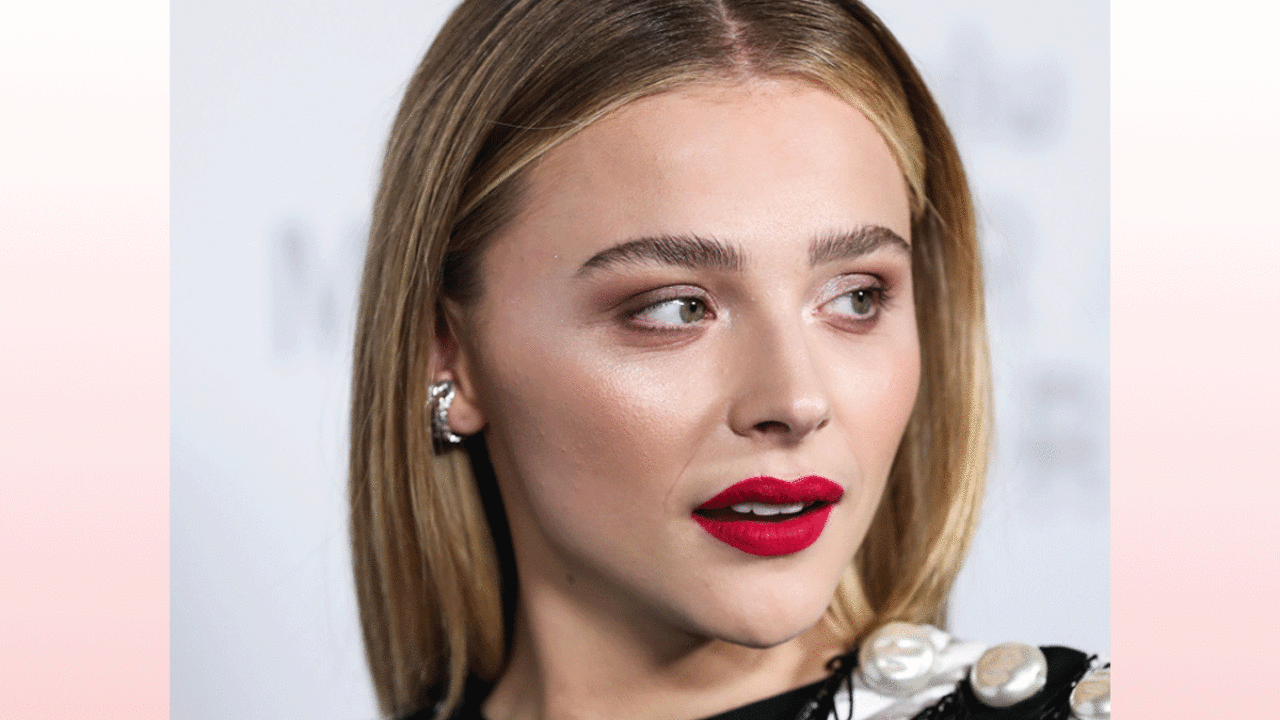 The kid behind Chloe Grace Moretz looks like a man in his 30's : r