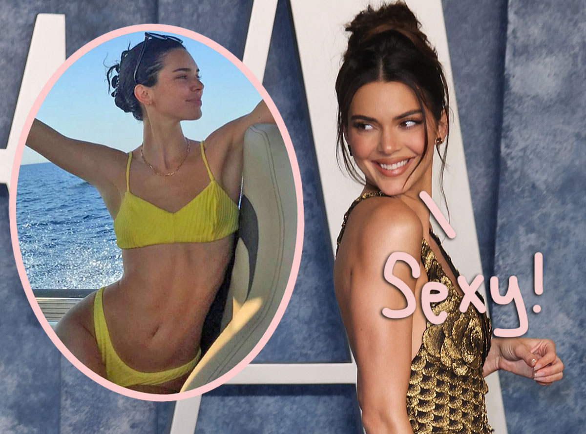 Kendall Jenner covers her breasts with her hands as she wears a  barely-there undershirt