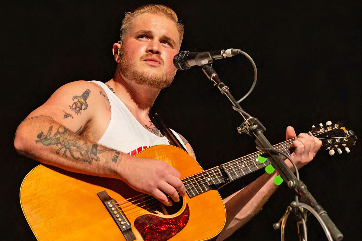 Zach Bryan Halts Concert To Scold Audience After Fan Throws Object On