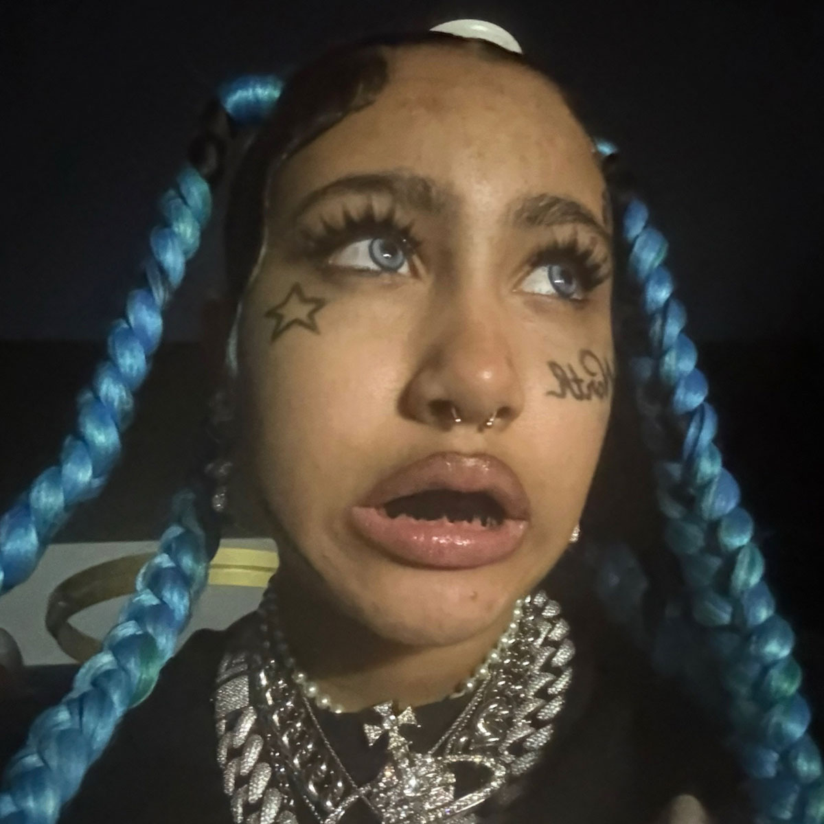 North West debuts fake face tattoos and piercings