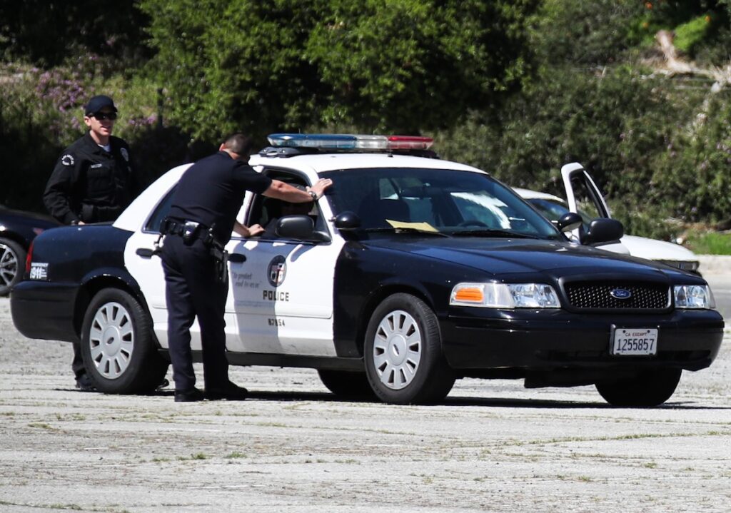 Texas Man Arrested Amid Investigation Into Woman's Suspicious Death Snaps Mugshot In UNBELIEVABLE Hoodie