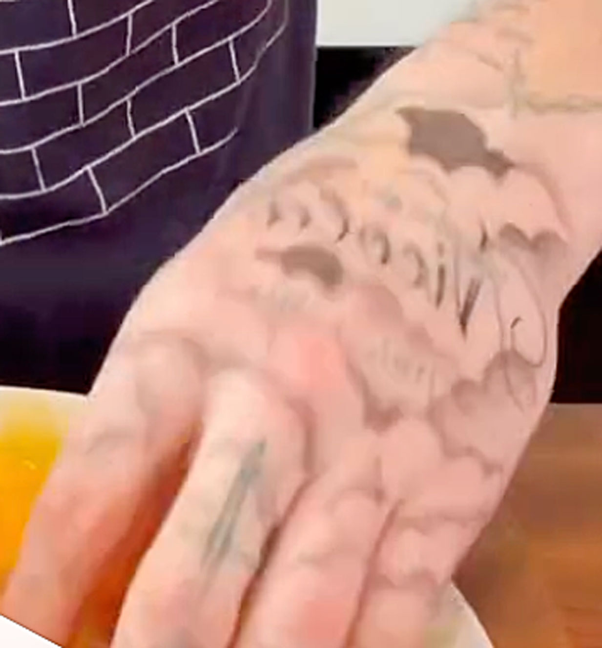 Brooklyn beckham covered hand tattoos