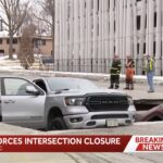 OMG! Watch The Terrifying Moment Sinkhole Swallows Two Cars At A Red Light!