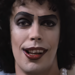 Tim Curry Throwback Interview: Watch Him Describe The 'Grisly' Role He Made Iconic In The Rocky Horror Picture Show