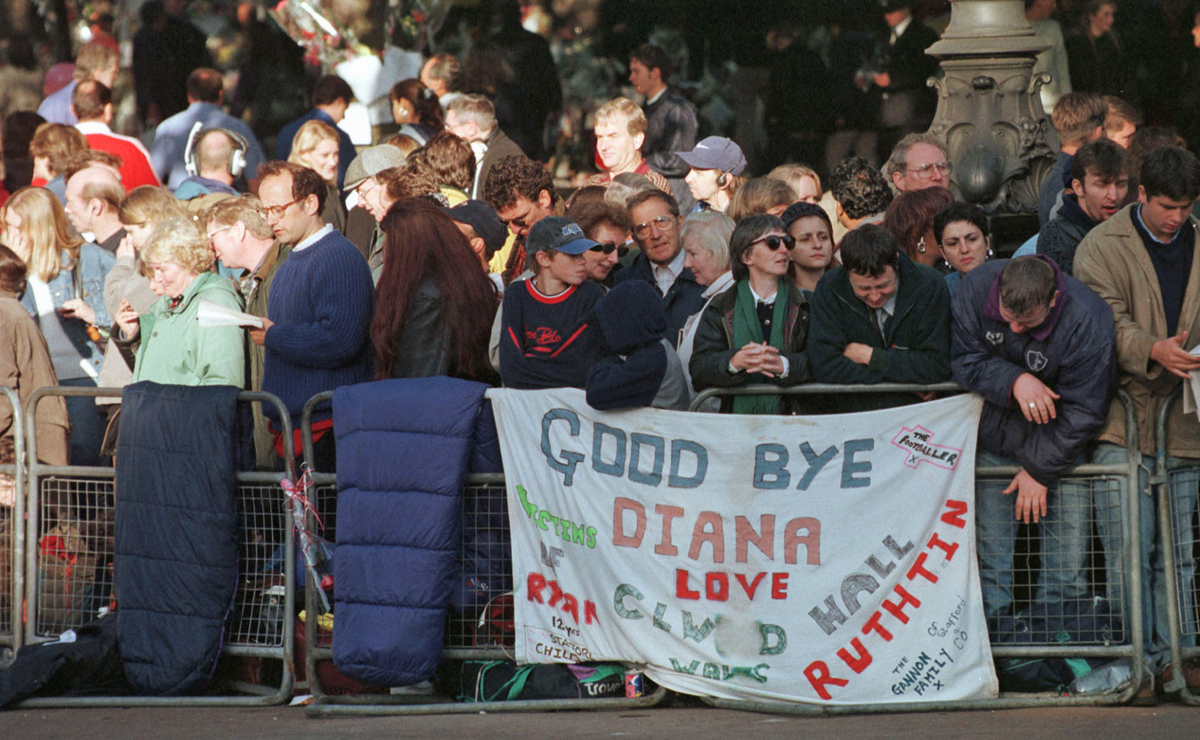 This is a photo of Princess Diana's public funeral. It shows members of the public mourning the loss of Princess Diana. 